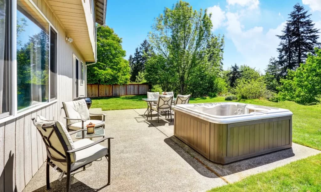 Custom concrete hot tub pad with broom finish installed by Hot Tub Pads in Ontario
