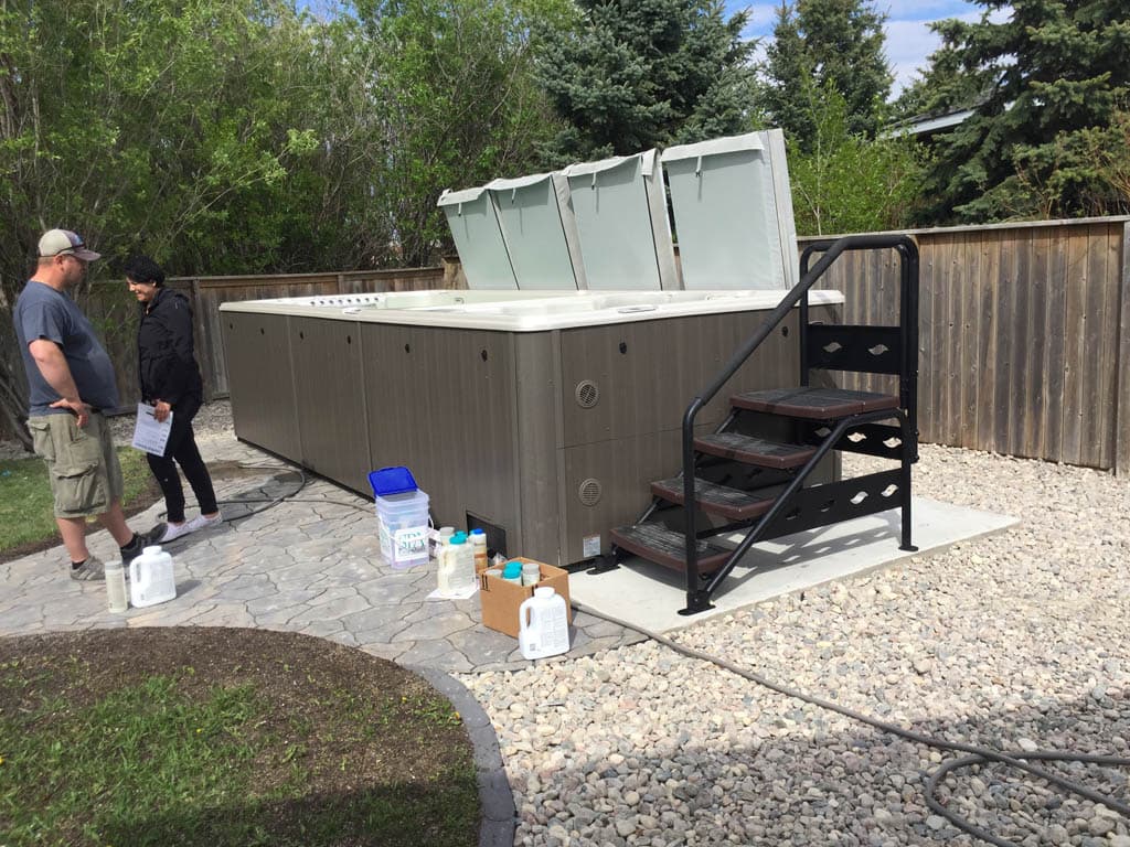 Completed hot tub pad with broom finish ready for spa installation in Ontario